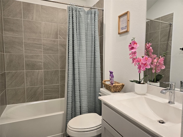 bathroom featuring toilet, shower / bath combo, and vanity