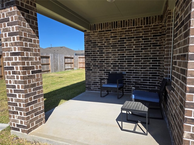 view of patio / terrace featuring fence