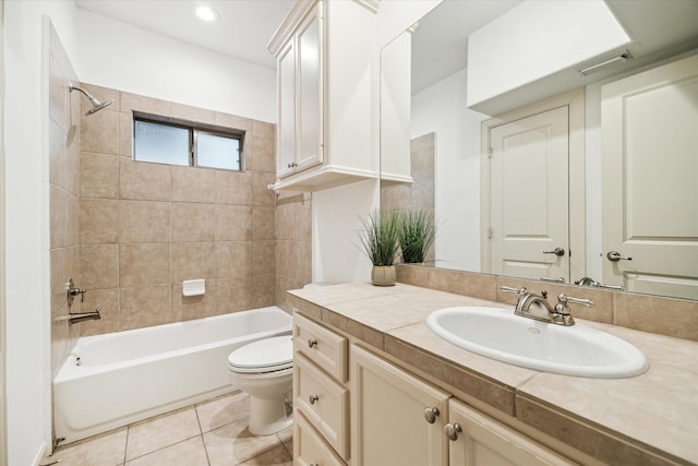 full bathroom with visible vents, shower / bath combination, toilet, vanity, and tile patterned flooring