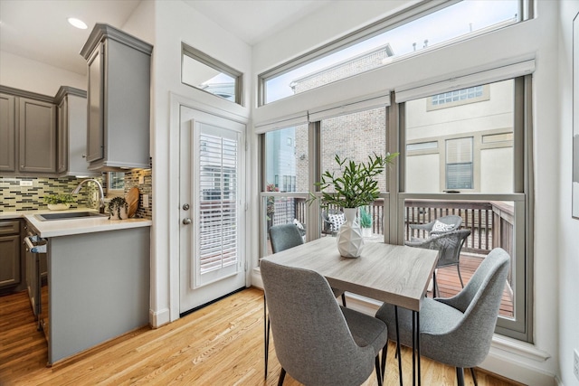 dining area featuring recessed lighting and light wood-style flooring