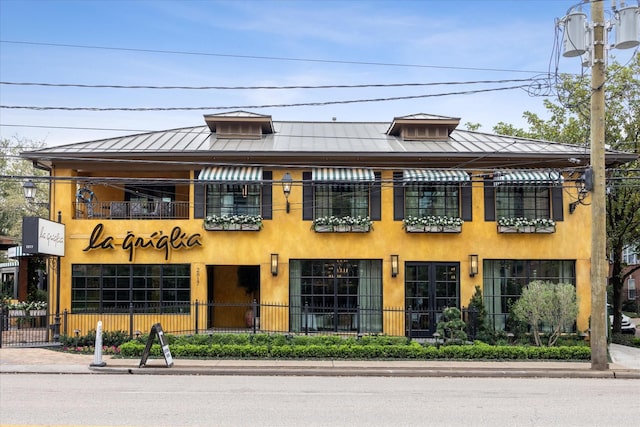 view of building exterior featuring fence