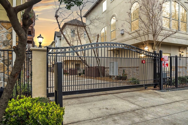 view of gate featuring fence