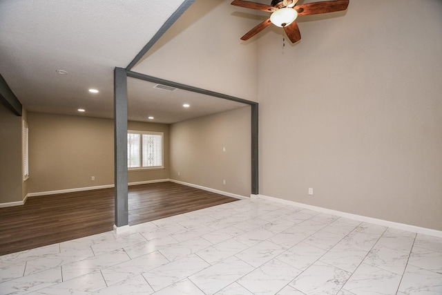 unfurnished room with marble finish floor, recessed lighting, visible vents, a ceiling fan, and baseboards