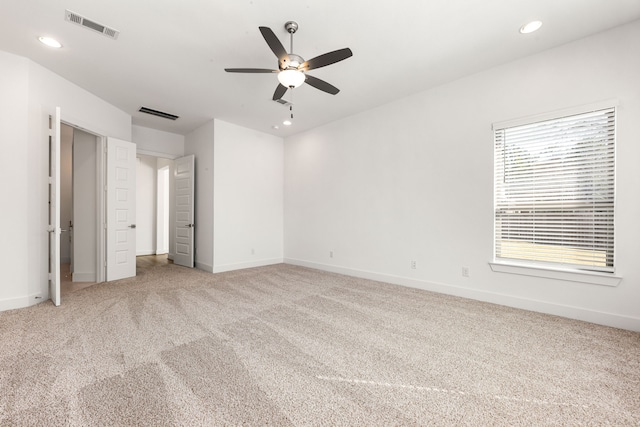 unfurnished bedroom with baseboards, recessed lighting, visible vents, and light colored carpet