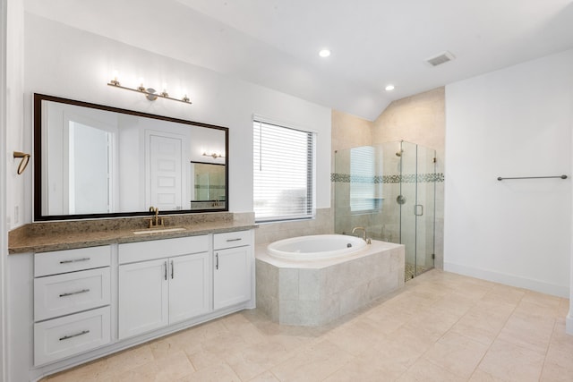 full bath featuring a stall shower, visible vents, a garden tub, vaulted ceiling, and vanity