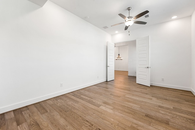 spare room featuring recessed lighting, visible vents, light wood-style flooring, and baseboards