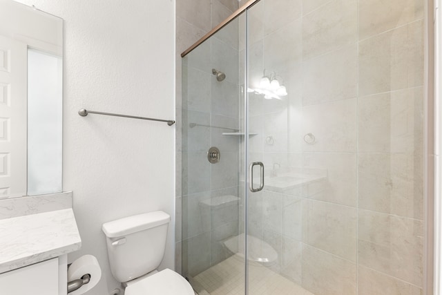 full bath with toilet, a shower stall, and vanity