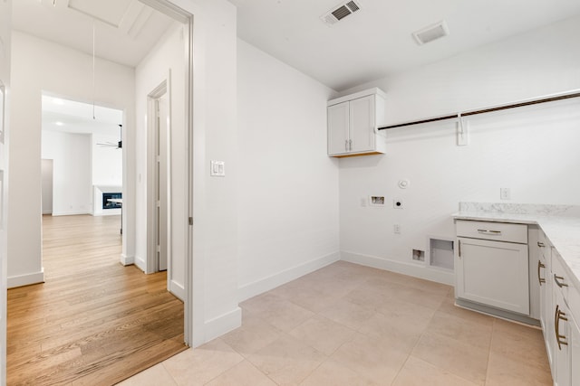 washroom featuring washer hookup, visible vents, attic access, gas dryer hookup, and electric dryer hookup