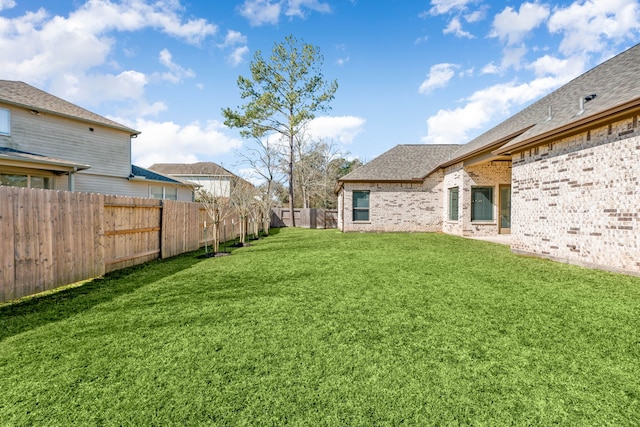 view of yard featuring a fenced backyard