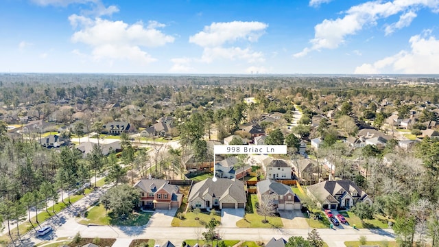 birds eye view of property with a residential view