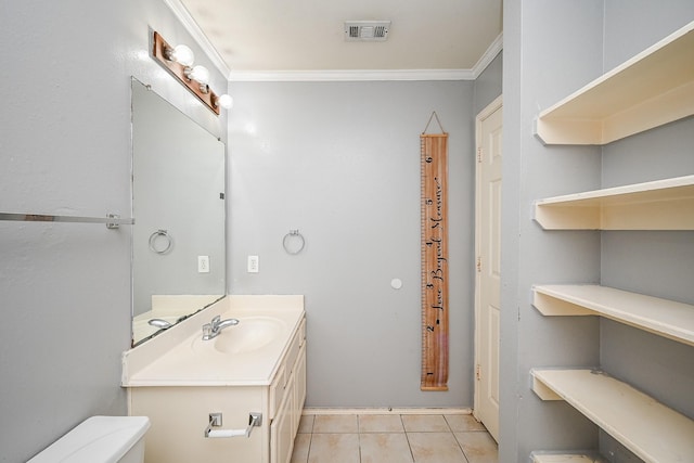 bathroom featuring tile patterned flooring, visible vents, crown molding, and toilet