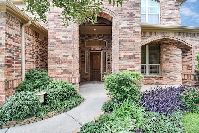 entrance to property with brick siding