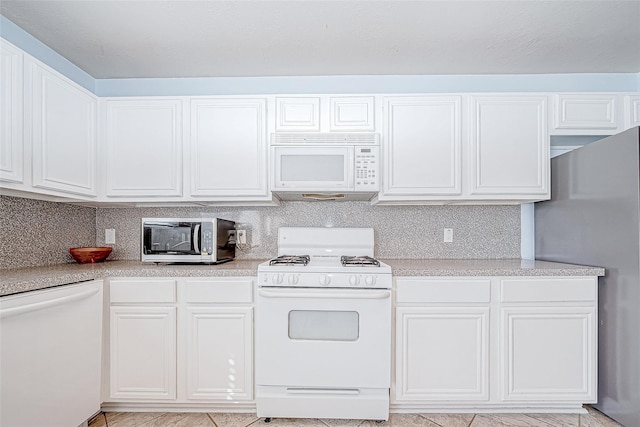 kitchen with white cabinetry, appliances with stainless steel finishes, and light countertops