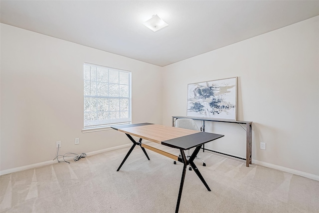 office area with light colored carpet and baseboards