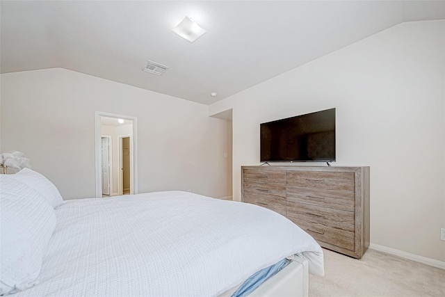 bedroom featuring lofted ceiling, visible vents, light carpet, and baseboards