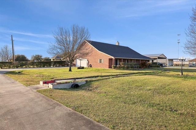 view of home's exterior featuring a lawn and a chimney