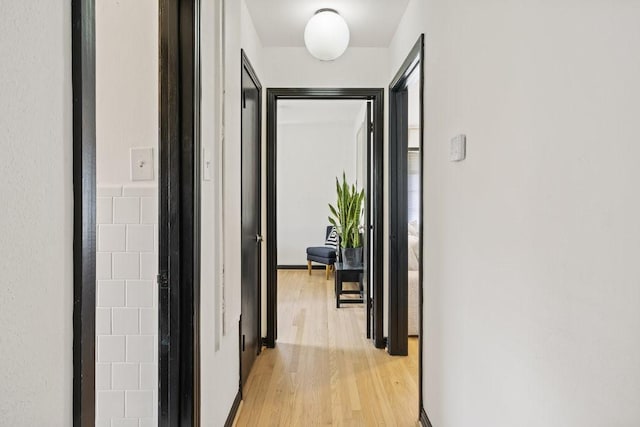 corridor featuring light wood-style floors