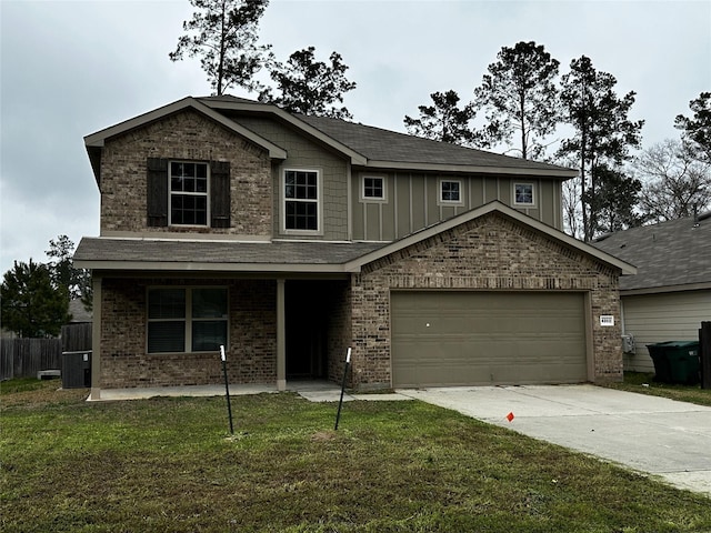 view of front of home with driveway, a front lawn, board and batten siding, and brick siding