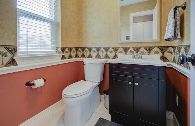 bathroom with vanity, toilet, and tile patterned floors