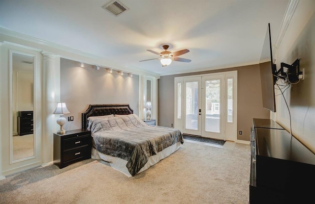 bedroom featuring access to exterior, french doors, visible vents, ornamental molding, and light carpet