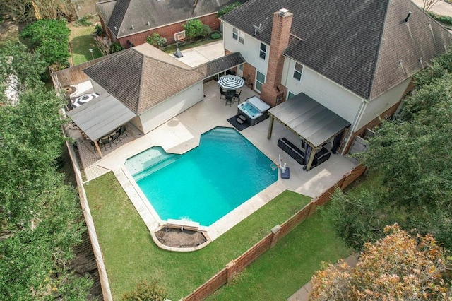 pool featuring a fenced backyard, outdoor dining area, and a patio