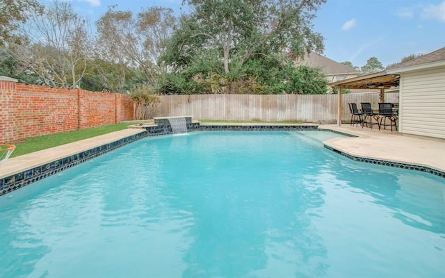 view of swimming pool featuring a patio, a fenced backyard, and a fenced in pool