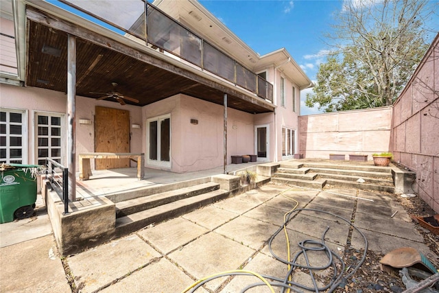 view of patio featuring a ceiling fan and french doors