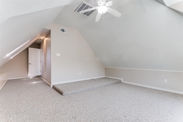 bonus room with carpet floors, lofted ceiling, and visible vents