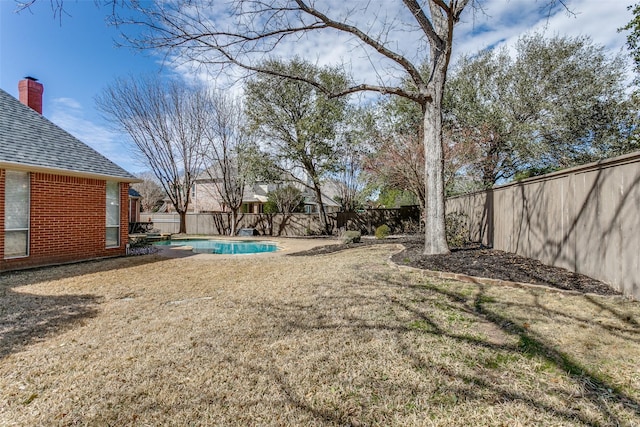 view of yard featuring a fenced backyard and a fenced in pool