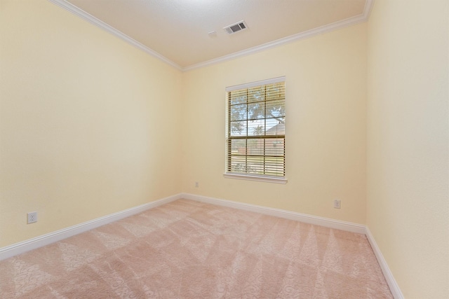 empty room with light carpet, baseboards, visible vents, and crown molding