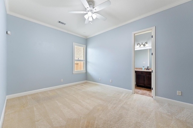 unfurnished room with light carpet, visible vents, and crown molding