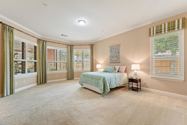 bedroom with light carpet, crown molding, visible vents, and baseboards