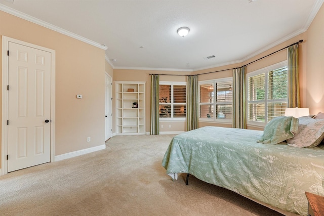 carpeted bedroom featuring ornamental molding, visible vents, and baseboards