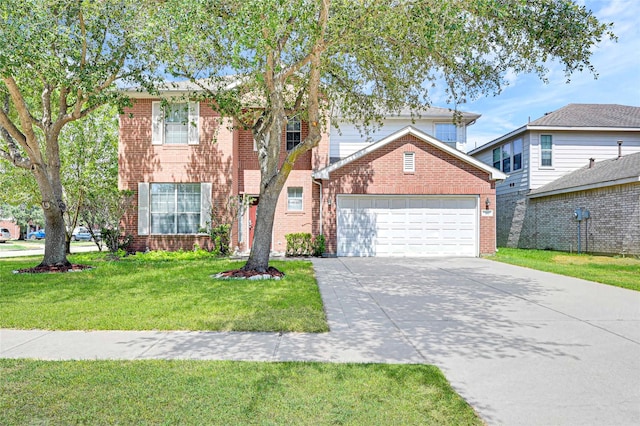 traditional home with concrete driveway, brick siding, an attached garage, and a front yard