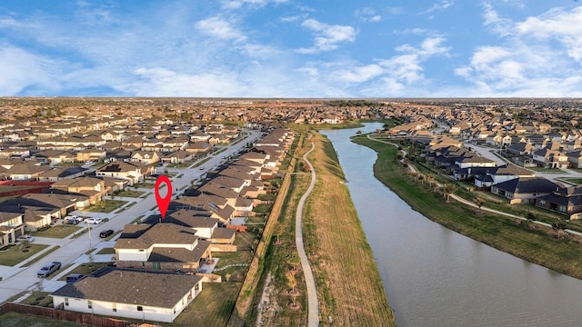 aerial view with a water view and a residential view