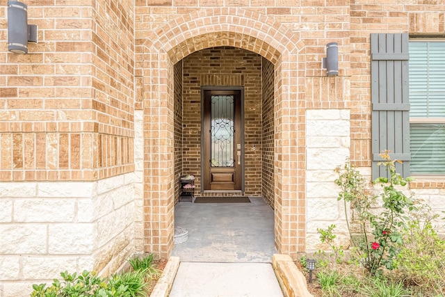 property entrance with brick siding