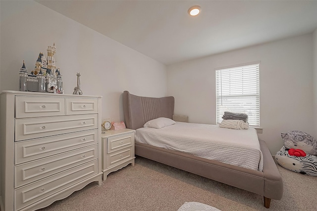 bedroom featuring light carpet