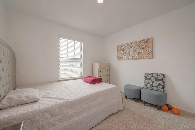 carpeted bedroom with baseboards