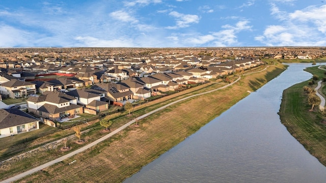 birds eye view of property featuring a water view and a residential view