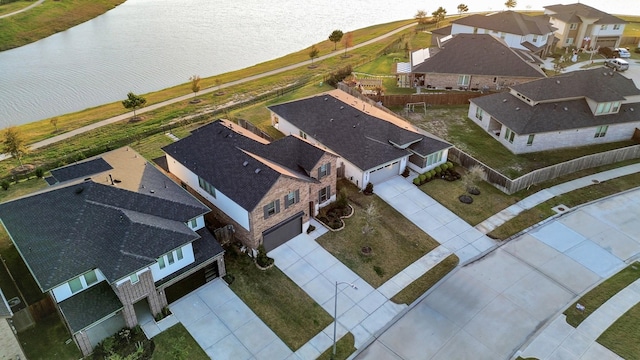 aerial view featuring a water view and a residential view