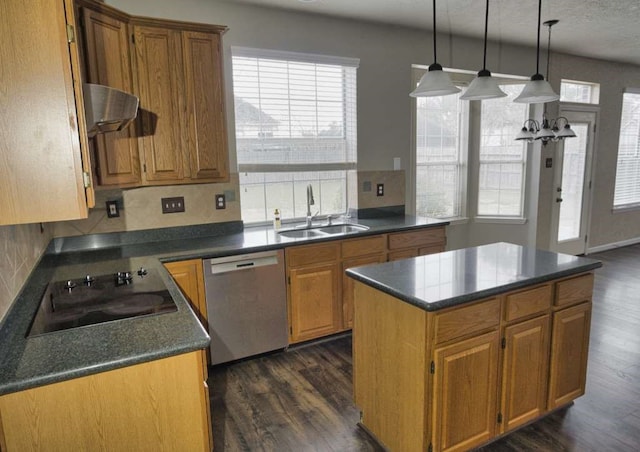 57 Sunrose Ct, Lake Jackson, TX 77566 - kitchen featuring under cabinet range hood, a sink, a kitchen island, stainless steel dishwasher, and dark countertops