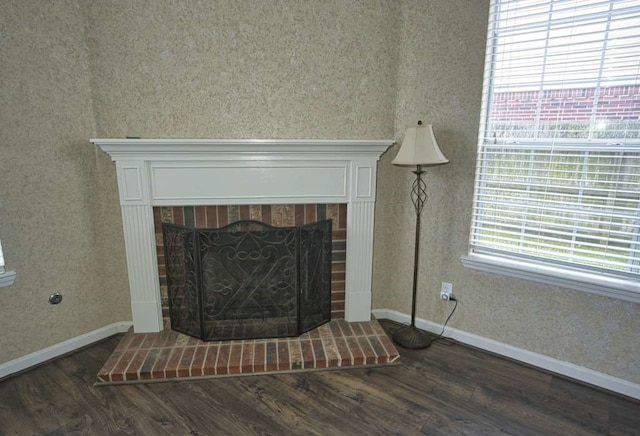 57 Sunrose Ct, Lake Jackson, TX 77566 - interior details featuring a fireplace, baseboards, and wood finished floors