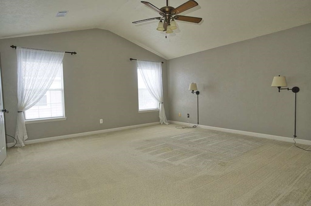 57 Sunrose Ct, Lake Jackson, TX 77566 - empty room featuring vaulted ceiling, baseboards, a ceiling fan, and light colored carpet