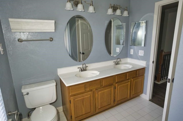57 Sunrose Ct, Lake Jackson, TX 77566 - full bathroom featuring tile patterned flooring, a sink, toilet, and double vanity
