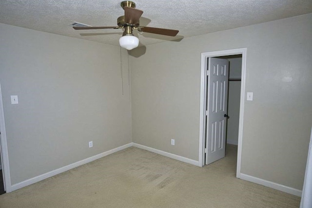 57 Sunrose Ct, Lake Jackson, TX 77566 - unfurnished room featuring baseboards, ceiling fan, a textured ceiling, and light colored carpet