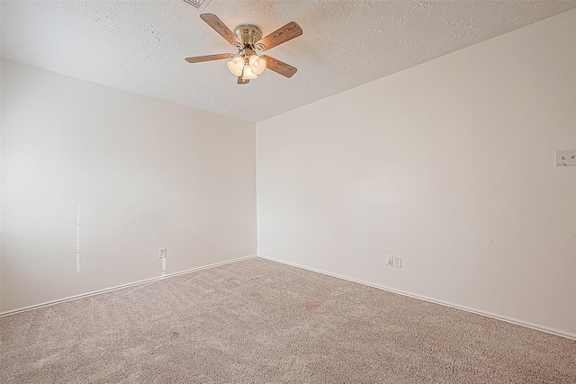 unfurnished room with a textured ceiling, ceiling fan, carpet, and baseboards