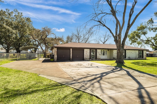 view of front of home featuring brick siding, concrete driveway, an attached garage, a front yard, and fence