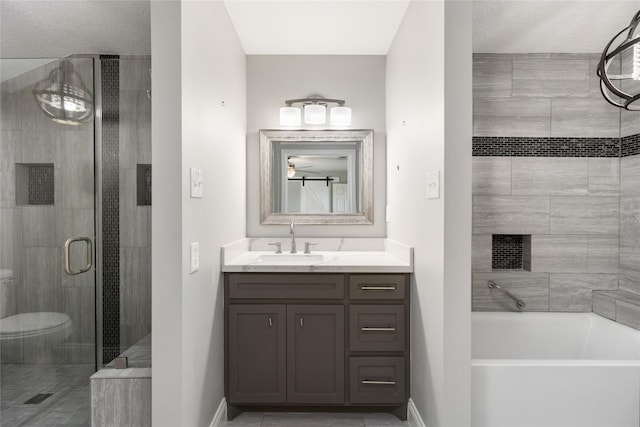 bathroom featuring a garden tub, a shower stall, vanity, and baseboards