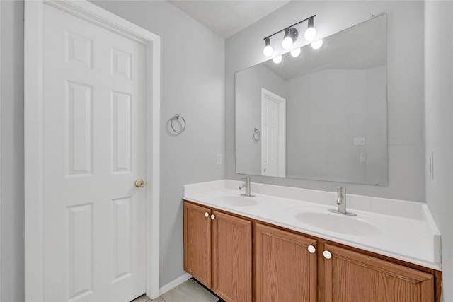 bathroom with double vanity and a sink