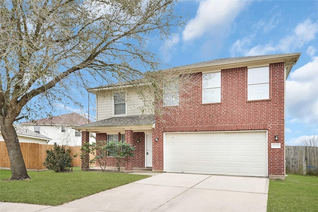 traditional-style house with driveway, fence, a front lawn, and brick siding